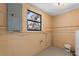 The utility room features painted walls and concrete floors at 1229 Rawls Dr, Lakeland, FL 33801
