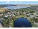 Aerial view of neighborhood with many lakes and houses at 128 Lake Ring Dr, Winter Haven, FL 33884