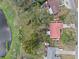 Overhead shot showing the house, large yard and surrounding area at 128 Lake Ring Dr, Winter Haven, FL 33884