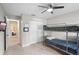 Cozy bedroom featuring a bunk bed, ceiling fan, and neutral paint, great for  at 128 Lake Ring Dr, Winter Haven, FL 33884