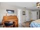 Bedroom with a desk area for studying or work, and connecting doors to the hallway and bath at 128 Lake Ring Dr, Winter Haven, FL 33884