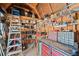Interior shot of an outbuilding showcasing organized shelving, a sturdy workbench, and ample storage solutions at 128 Lake Ring Dr, Winter Haven, FL 33884