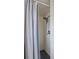 Small shower area with white tiled walls and a shower curtain at 128 Lake Ring Dr, Winter Haven, FL 33884