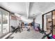 Spacious basement home gym with sliding glass doors and tile flooring at 15 Casarena Ct, Winter Haven, FL 33881
