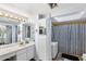 Bathroom features a double vanity with mirrors and lots of cabinets at 15 Casarena Ct, Winter Haven, FL 33881