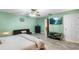 Bedroom features a large window, a ceiling fan, and neutral walls at 15 Casarena Ct, Winter Haven, FL 33881
