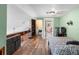 View of a bedroom with a bed, closet doors, and laminate flooring at 15 Casarena Ct, Winter Haven, FL 33881