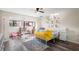 ' bedroom features laminate wood flooring, light walls and a ceiling fan at 15 Casarena Ct, Winter Haven, FL 33881