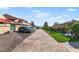 Paver driveway and landscaping near the lake at 15 Casarena Ct, Winter Haven, FL 33881