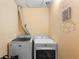 Laundry room with side-by-side Maytag washer and dryer at 15 Casarena Ct, Winter Haven, FL 33881