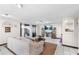 Cozy living room with tile flooring, a comfortable sofa, and a view of the sliding glass door at 15 Casarena Ct, Winter Haven, FL 33881
