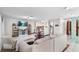 Bright living room with a cozy sofa, tile floors, and a view into the modern kitchen at 15 Casarena Ct, Winter Haven, FL 33881