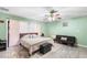 This spacious main bedroom includes closet, ceiling fan and seating area at 15 Casarena Ct, Winter Haven, FL 33881