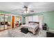 Spacious main bedroom featuring closet and ceiling fan at 15 Casarena Ct, Winter Haven, FL 33881