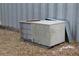 Exterior view of a used A/C unit beside a Quonset hut on a rural property at 151 W Hamlin Trl, Frostproof, FL 33843