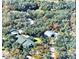 Expansive property featuring a home, outbuildings, and surrounded by lush trees at 151 W Hamlin Trl, Frostproof, FL 33843