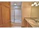 Bathroom features a shower with glass doors, a bathtub, and a neutral-toned vanity at 151 W Hamlin Trl, Frostproof, FL 33843