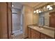 Bathroom featuring a tub/shower combo, vanity, and granite countertop at 151 W Hamlin Trl, Frostproof, FL 33843