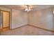 Spacious bedroom features neutral carpeting and easy access to the en-suite bathroom at 151 W Hamlin Trl, Frostproof, FL 33843