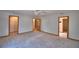 Spacious bedroom boasts carpet, natural light, and multiple access points at 151 W Hamlin Trl, Frostproof, FL 33843