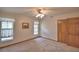 This cozy bedroom features carpeted floors, neutral walls, ceiling fan, and a closet for organized storage at 151 W Hamlin Trl, Frostproof, FL 33843