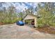 Exterior photo of attached carport with two parked cars at 151 W Hamlin Trl, Frostproof, FL 33843