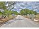 Community entrance with manicured grounds, signage, and convenient mailbox locations at 151 W Hamlin Trl, Frostproof, FL 33843