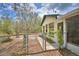 Charming home exterior with fenced yard and well maintained landscape at 151 W Hamlin Trl, Frostproof, FL 33843