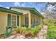 Charming house featuring a screened-in porch and lush landscaping at 151 W Hamlin Trl, Frostproof, FL 33843