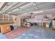Well-organized garage with shelving, work area, and plenty of open space for parking at 151 W Hamlin Trl, Frostproof, FL 33843