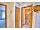 Hallway showing the entry to a bedroom and a bathroom at 151 W Hamlin Trl, Frostproof, FL 33843
