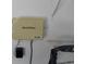 Close up of the Rain Bird Irrigation Controller, model RC-4Bi, mounted on the wall with shelving at 151 W Hamlin Trl, Frostproof, FL 33843
