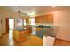 Bright and airy kitchen with wood cabinets, an island, and plenty of counter space at 151 W Hamlin Trl, Frostproof, FL 33843