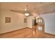 Open floor plan featuring hardwood floors, recessed lights, and a view into the foyer at 151 W Hamlin Trl, Frostproof, FL 33843
