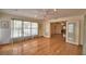 Bright living room featuring hardwood floors, French doors, recessed lights, and sheer curtains at 151 W Hamlin Trl, Frostproof, FL 33843