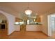 Spacious living and dining area with hardwood floors and views of the kitchen and fireplace at 151 W Hamlin Trl, Frostproof, FL 33843