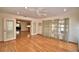 Open living room with hardwood floors, windows, French doors, and recessed lighting at 151 W Hamlin Trl, Frostproof, FL 33843