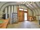 Interior view of metal outbuilding with work tables and shelving at 151 W Hamlin Trl, Frostproof, FL 33843