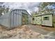 Exterior shot of two outbuildings with painted doors and metal siding at 151 W Hamlin Trl, Frostproof, FL 33843