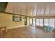 Enclosed patio with tiled flooring, bright windows, and comfortable seating at 151 W Hamlin Trl, Frostproof, FL 33843