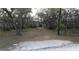 Angle view of the front of the property showing the Quonset hut and shed at 151 W Hamlin Trl, Frostproof, FL 33843