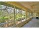 A screened porch provides a scenic view of the lush backyard at 151 W Hamlin Trl, Frostproof, FL 33843