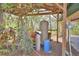 Outdoor equipment area featuring a water filtration system under a wooden pergola at 151 W Hamlin Trl, Frostproof, FL 33843