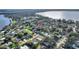 Aerial view of a community featuring spacious homes, lush greenery, and access to a tranquil lake at 1904 Eloise Cove Dr, Winter Haven, FL 33884