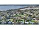 Aerial view of a residential neighborhood near a lake showcasing well-maintained homes and yards at 1904 Eloise Cove Dr, Winter Haven, FL 33884