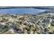 Overhead shot of a neighborhood by the lake, featuring tree-lined streets and neatly kept properties at 1904 Eloise Cove Dr, Winter Haven, FL 33884