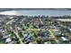 Aerial view of neighborhood with mature trees and close proximity to the lake at 1904 Eloise Cove Dr, Winter Haven, FL 33884