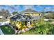 View of the back of the house showing the screened lanai, windows, and yard at 1904 Eloise Cove Dr, Winter Haven, FL 33884