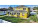 Exterior view of the back of the house and large backyard with white fencing at 1904 Eloise Cove Dr, Winter Haven, FL 33884
