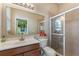 Bathroom showcasing glass enclosed shower, vanity with sink and large mirror at 1904 Eloise Cove Dr, Winter Haven, FL 33884